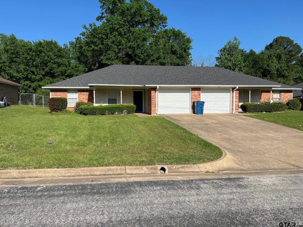 16067 Echo Glen Dr, Tyler, TX 75703 - single story home with a garage, brick siding, concrete driveway, and roof with shingles