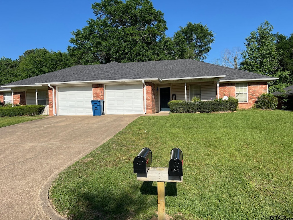 16067 Echo Glen Dr, Tyler, TX 75703 - single story home with a garage, brick siding, and a front lawn