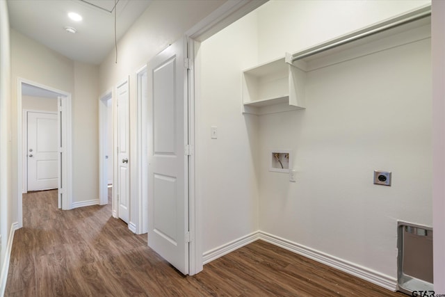 clothes washing area with electric dryer hookup, dark hardwood / wood-style floors, hookup for a washing machine, and heating unit