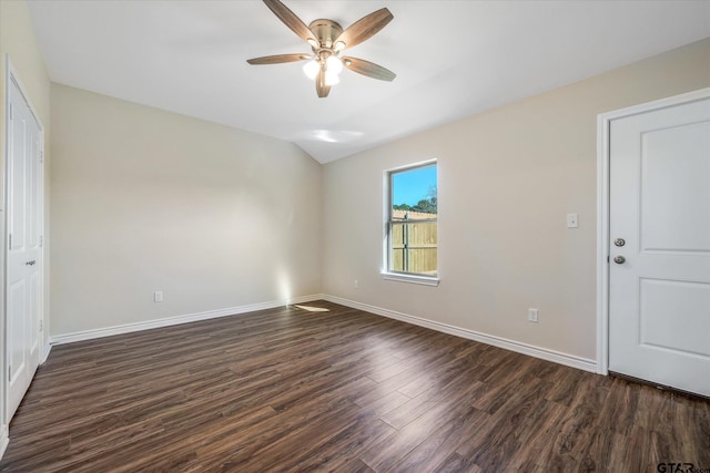 spare room with ceiling fan and dark hardwood / wood-style floors