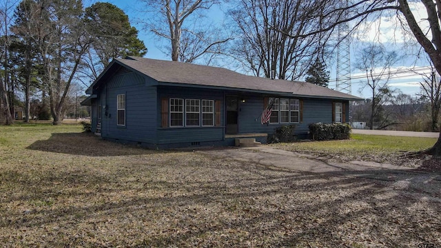 ranch-style home featuring a front yard, crawl space, and roof with shingles