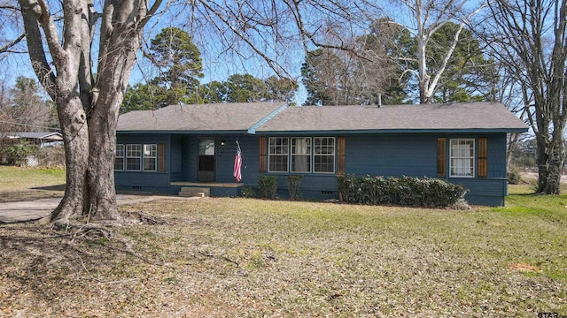 ranch-style house featuring a shingled roof, crawl space, and a front lawn