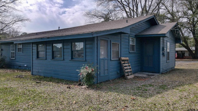 view of home's exterior featuring crawl space and a lawn