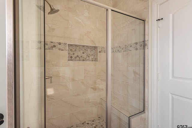 bathroom featuring an enclosed shower