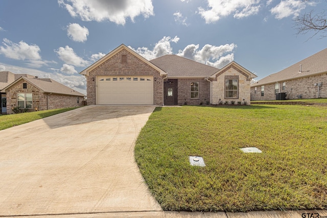 single story home featuring a front lawn, a garage, and central AC unit