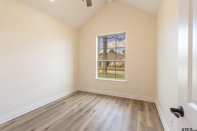 unfurnished room featuring ceiling fan, vaulted ceiling with beams, and light hardwood / wood-style flooring