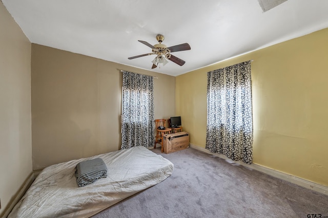 carpeted bedroom with ceiling fan