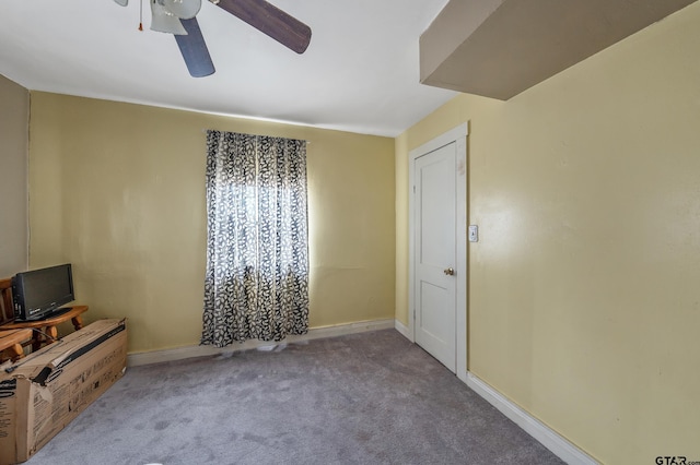 interior space with ceiling fan