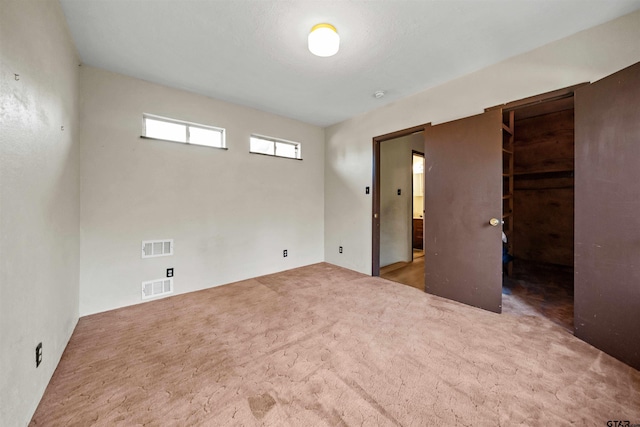 spare room featuring carpet