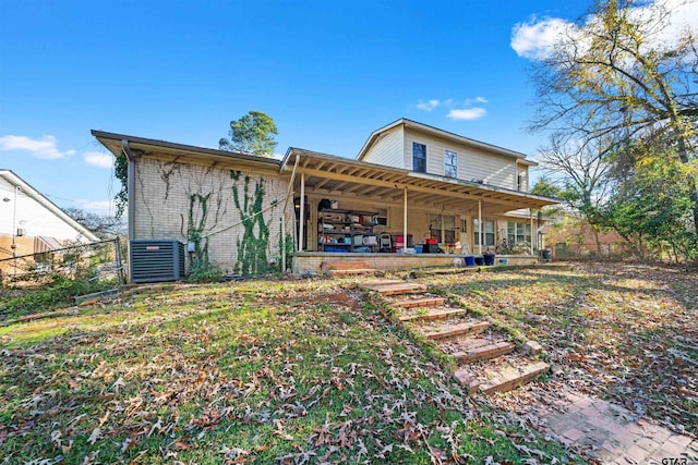 back of property featuring covered porch and central AC