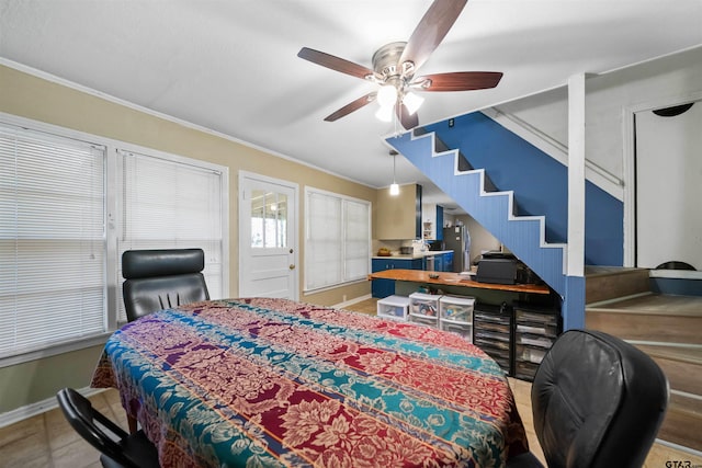 bedroom featuring ceiling fan and crown molding