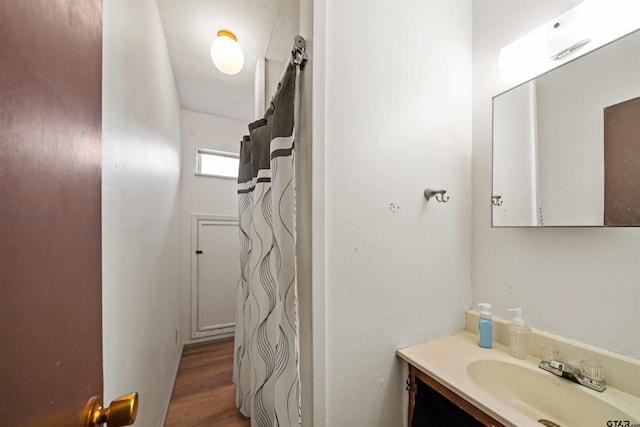 bathroom with vanity and hardwood / wood-style flooring