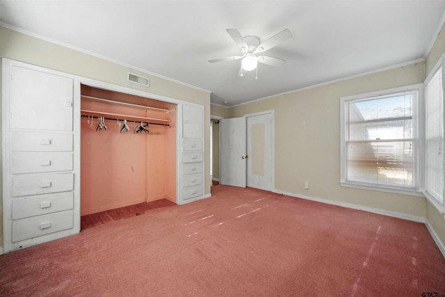 unfurnished bedroom with carpet floors, a closet, ceiling fan, and ornamental molding