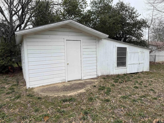 view of shed with fence