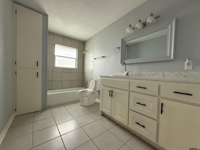 bathroom featuring toilet, vanity, shower / washtub combination, and tile patterned floors