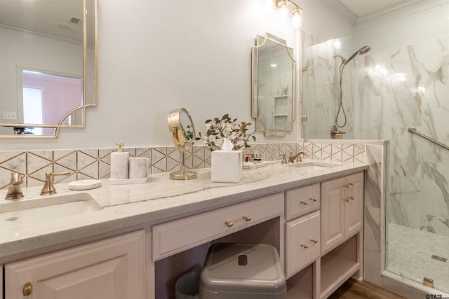 bathroom with vanity, backsplash, a shower with shower door, and ornamental molding