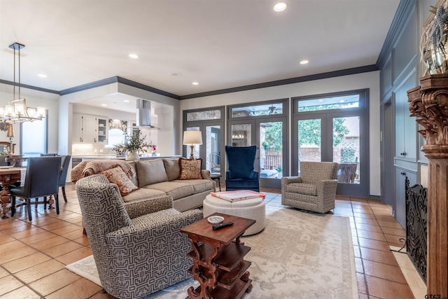 living room with ornamental molding, light tile patterned flooring, and a chandelier