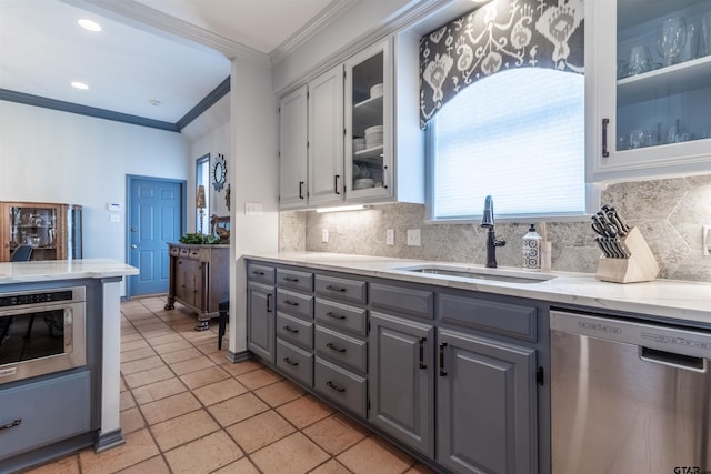 kitchen featuring white cabinetry, sink, stainless steel dishwasher, and gray cabinetry