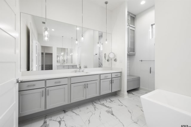 4645 Cascades Blvd, Tyler, TX 75709 - full bathroom featuring marble finish floors, vanity, a soaking tub, recessed lighting, and baseboards