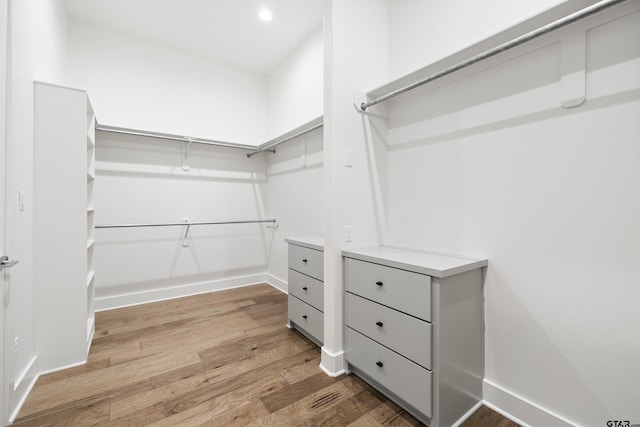 4645 Cascades Blvd, Tyler, TX 75709 - walk in closet with wood finished floors