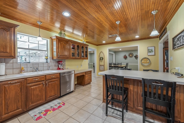 13094 Fm 2010, Chandler, TX 75758 - kitchen featuring dishwasher, a breakfast bar area, light countertops, wooden ceiling, and hanging light fixtures