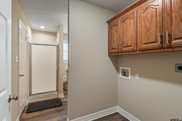 13094 Fm 2010, Chandler, TX 75758 - clothes washing area featuring cabinet space, electric dryer hookup, dark wood-style flooring, hookup for a washing machine, and baseboards