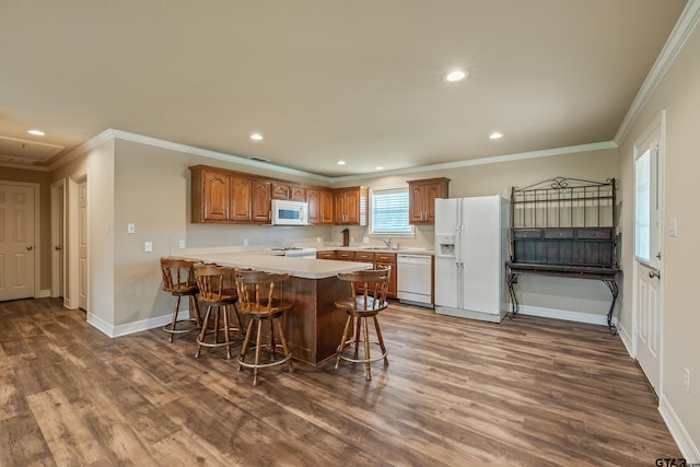 13094 Fm 2010, Chandler, TX 75758 - kitchen with white appliances, a peninsula, dark wood-type flooring, a sink, and recessed lighting