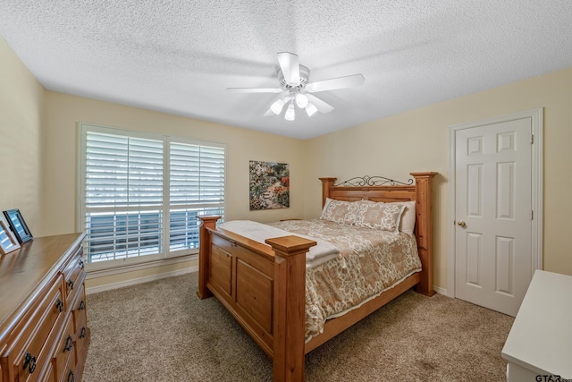 13094 Fm 2010, Chandler, TX 75758 - bedroom with light colored carpet, ceiling fan, a textured ceiling, and baseboards