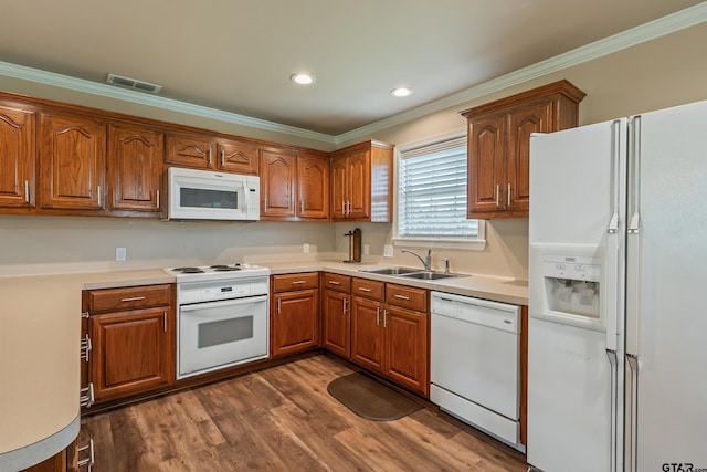 13094 Fm 2010, Chandler, TX 75758 - kitchen with white appliances, a sink, crown molding, brown cabinets, and dark wood-style floors