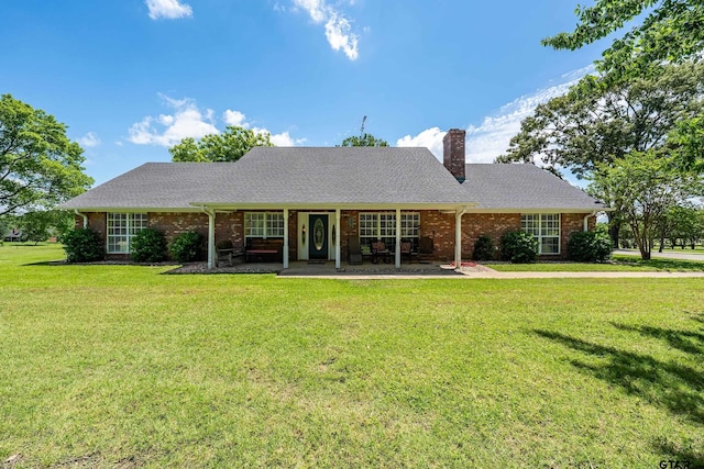13094 Fm 2010, Chandler, TX 75758 - back of house with a chimney, a lawn, and brick siding