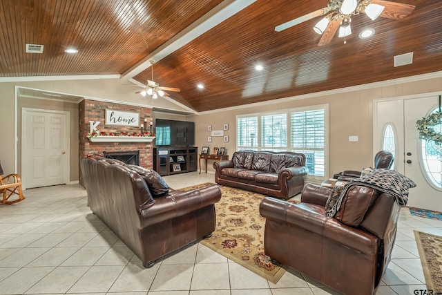 13094 Fm 2010, Chandler, TX 75758 - living area with a ceiling fan, light tile patterned flooring, wooden ceiling, crown molding, and a brick fireplace