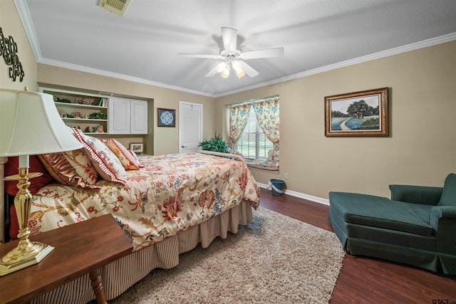 bedroom with ceiling fan, dark hardwood / wood-style flooring, and crown molding