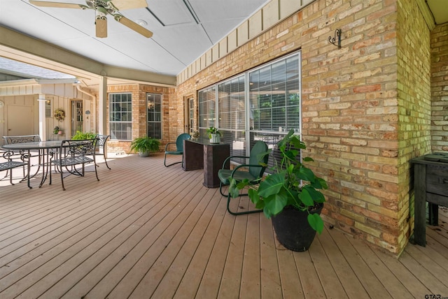 wooden deck featuring ceiling fan