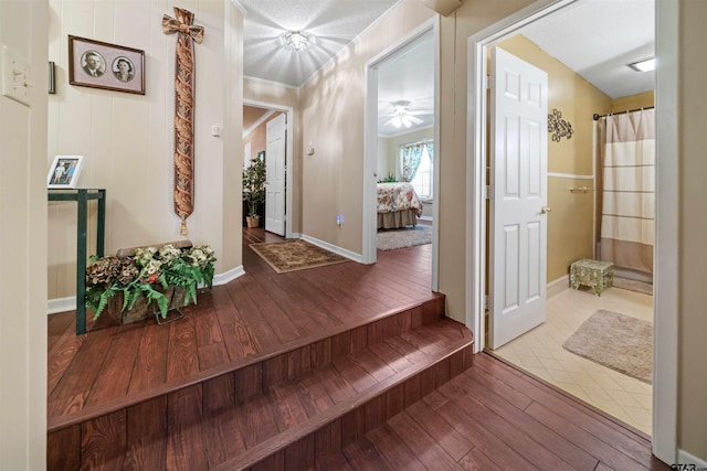 interior space with hardwood / wood-style floors and ceiling fan