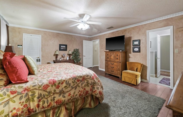 bedroom with dark hardwood / wood-style floors, ceiling fan, crown molding, and a textured ceiling