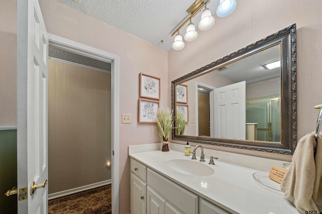 bathroom featuring vanity and a textured ceiling