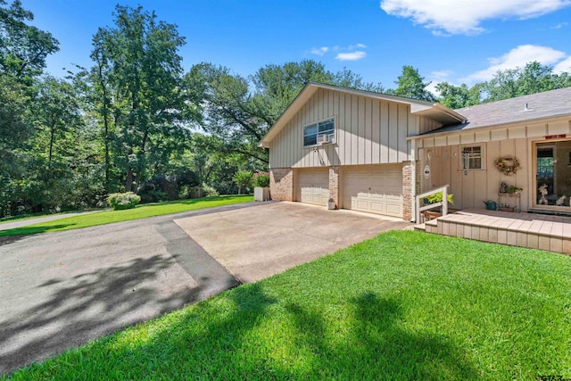 view of home's exterior with a lawn and a garage