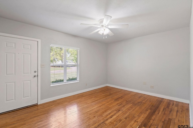 616 Arizona Ave, Wake Village, TX 75501 - unfurnished room with baseboards, a ceiling fan, and hardwood / wood-style flooring