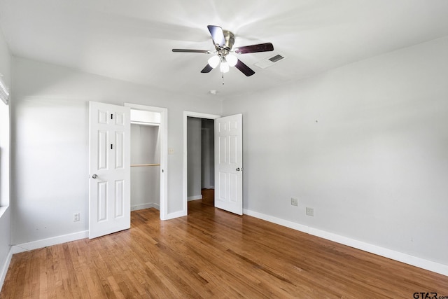 616 Arizona Ave, Wake Village, TX 75501 - unfurnished bedroom featuring light wood-style flooring, a closet, visible vents, a walk in closet, and baseboards