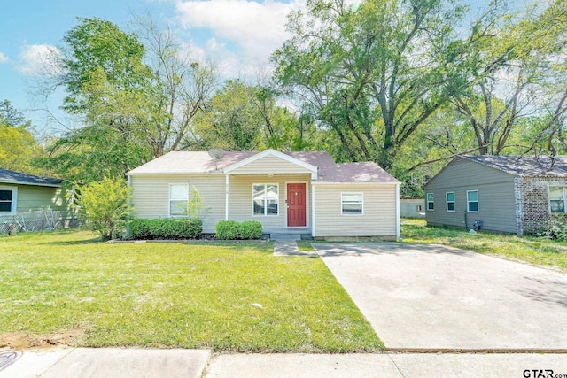 616 Arizona Ave, Wake Village, TX 75501 - view of front of home with driveway and a front lawn