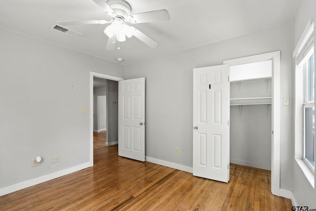 616 Arizona Ave, Wake Village, TX 75501 - unfurnished bedroom with visible vents, baseboards, a closet, ceiling fan, and wood finished floors
