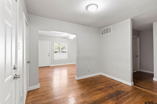 616 Arizona Ave, Wake Village, TX 75501 - empty room featuring wood-type flooring, visible vents, baseboards, and a ceiling fan