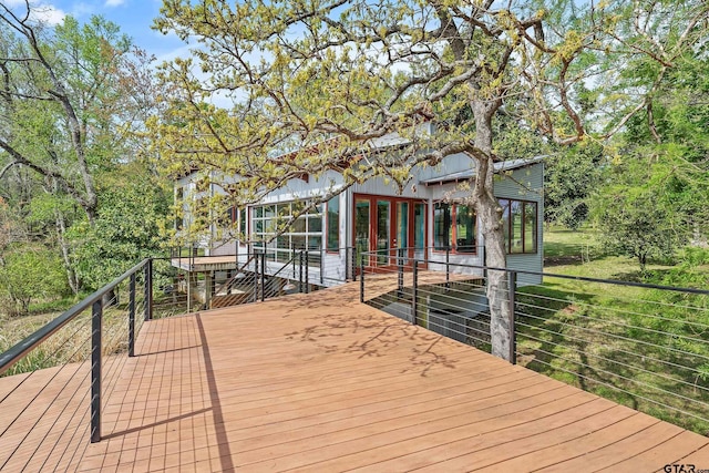wooden terrace with a sunroom
