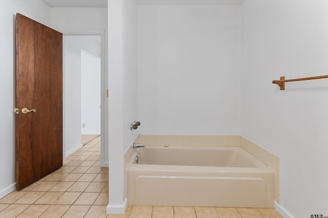 bathroom featuring a tub to relax in and tile patterned floors