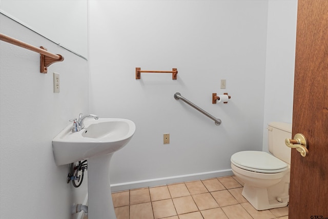 bathroom featuring tile patterned floors and toilet