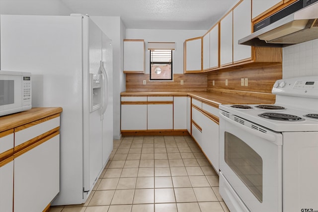 kitchen with white appliances, backsplash, white cabinets, a textured ceiling, and light tile patterned flooring