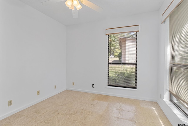 unfurnished room with ceiling fan