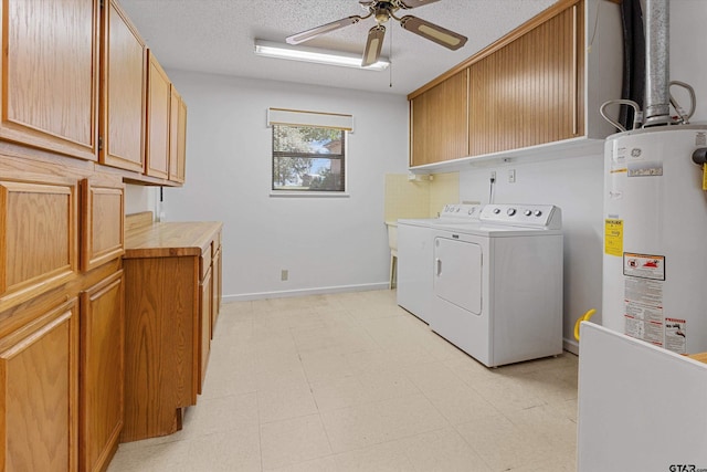 laundry area with cabinets, ceiling fan, separate washer and dryer, a textured ceiling, and water heater