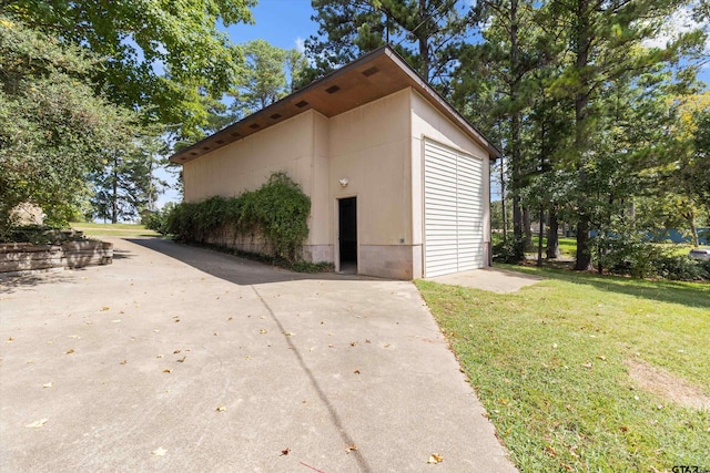 view of outdoor structure with a lawn