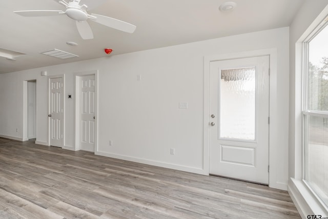 interior space with ceiling fan and light wood-type flooring